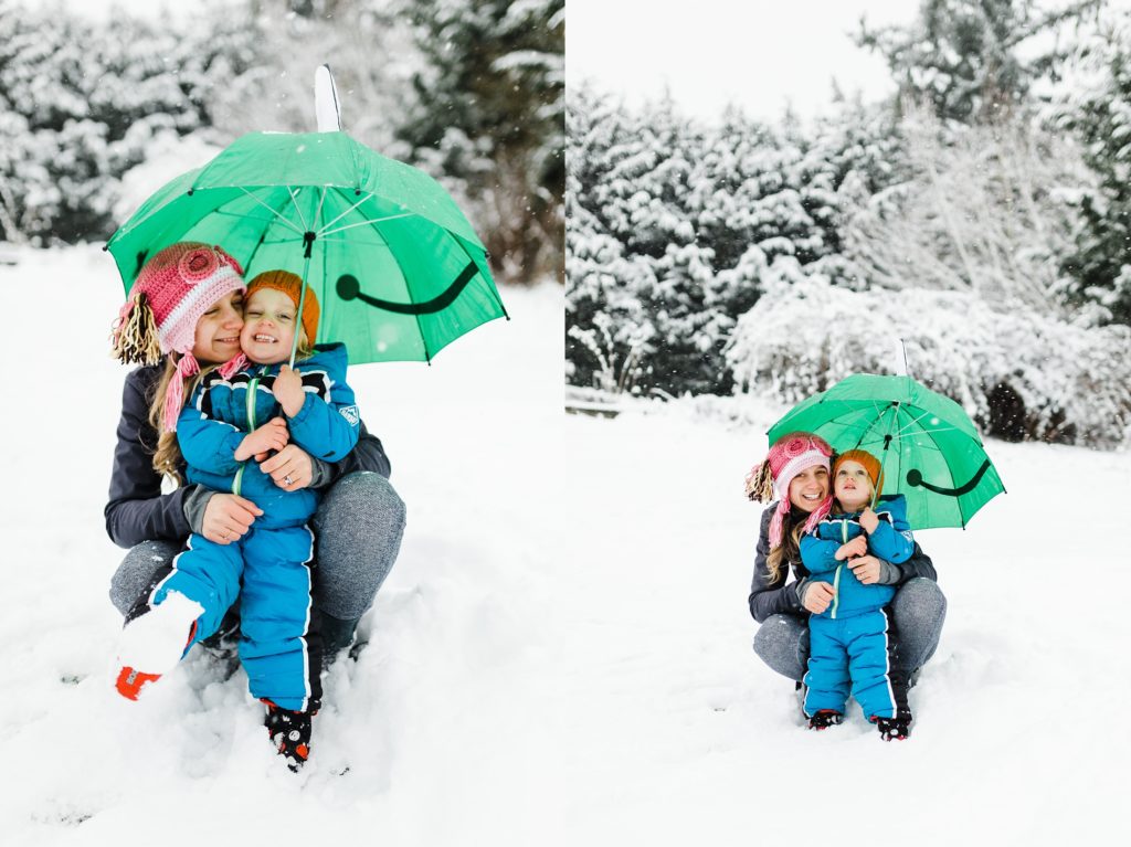 Mom and son snuggling in the snow