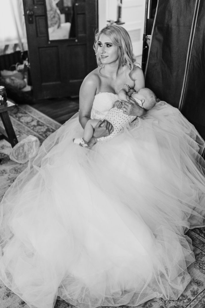 Breastfeeding Bride Smiles at bridal party