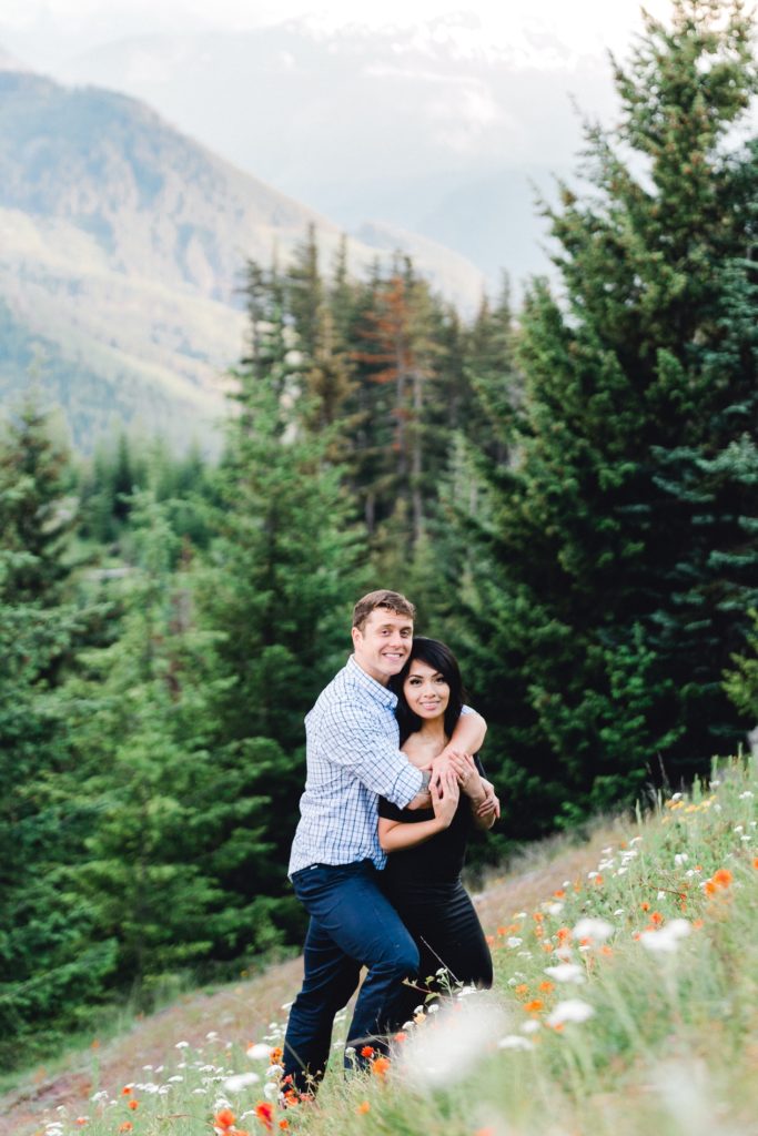 Couple hugging in wildflowers